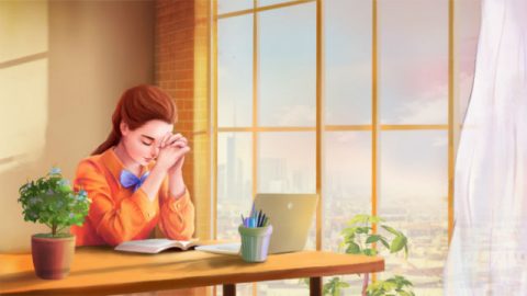 女孩在桌子上向神祷告图片